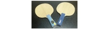 Two bare blades showing similar faces with different handle finishes