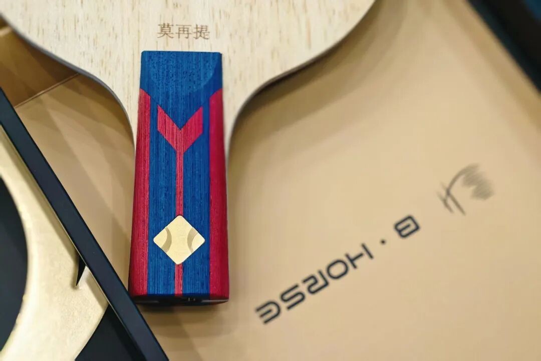 Assembled racket showing topsheet and sponge edge